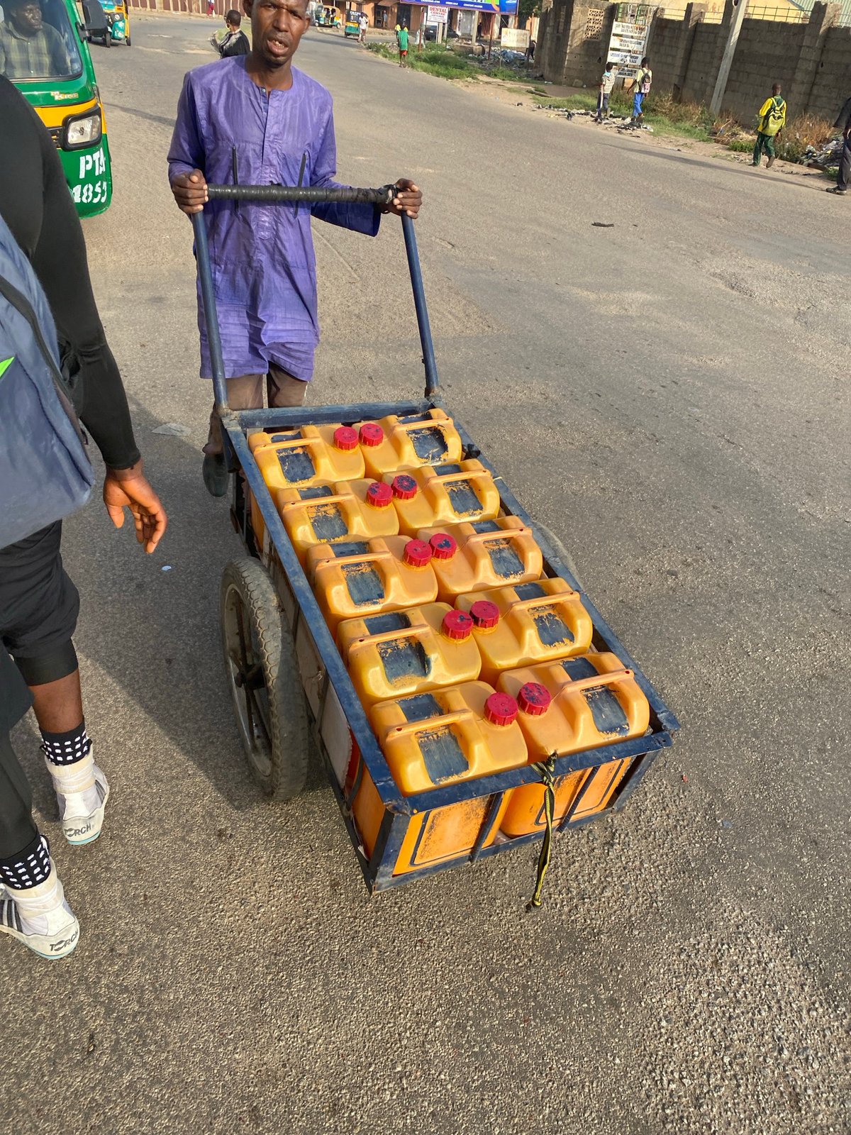 Morning street life documented around Jos roundabout sculpture