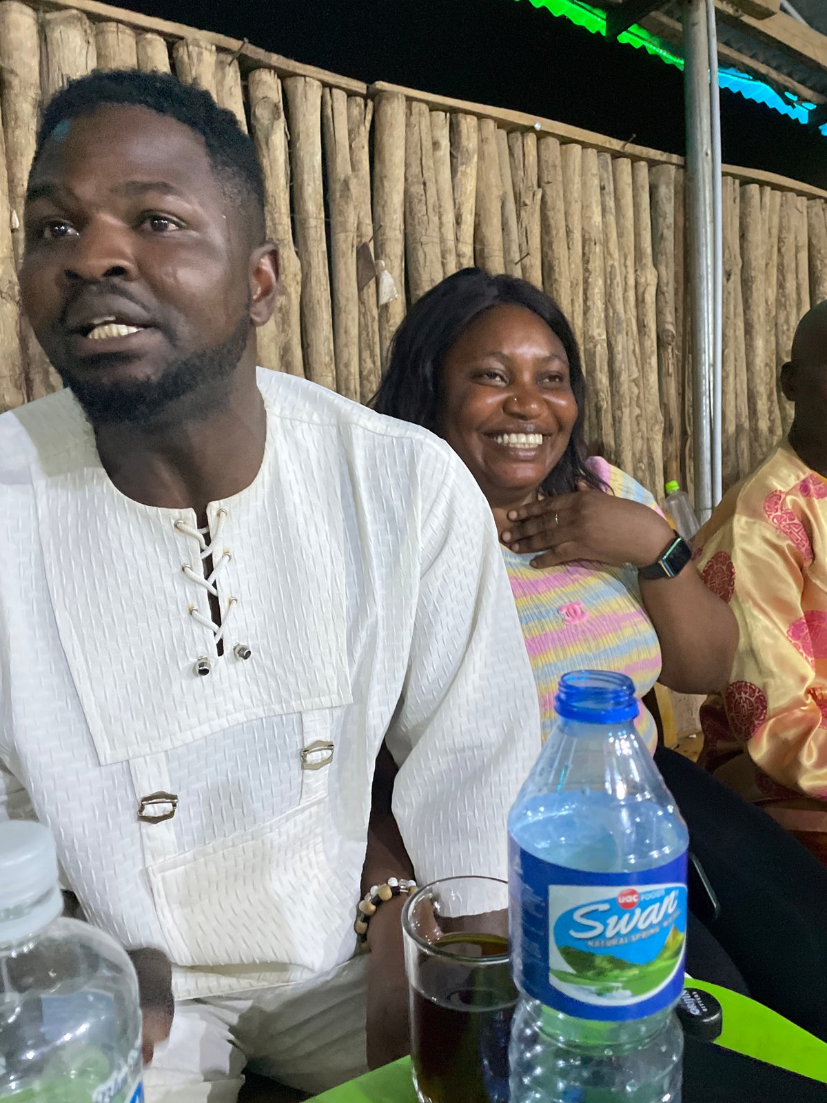 Evening social gathering with pool game captured in Jos