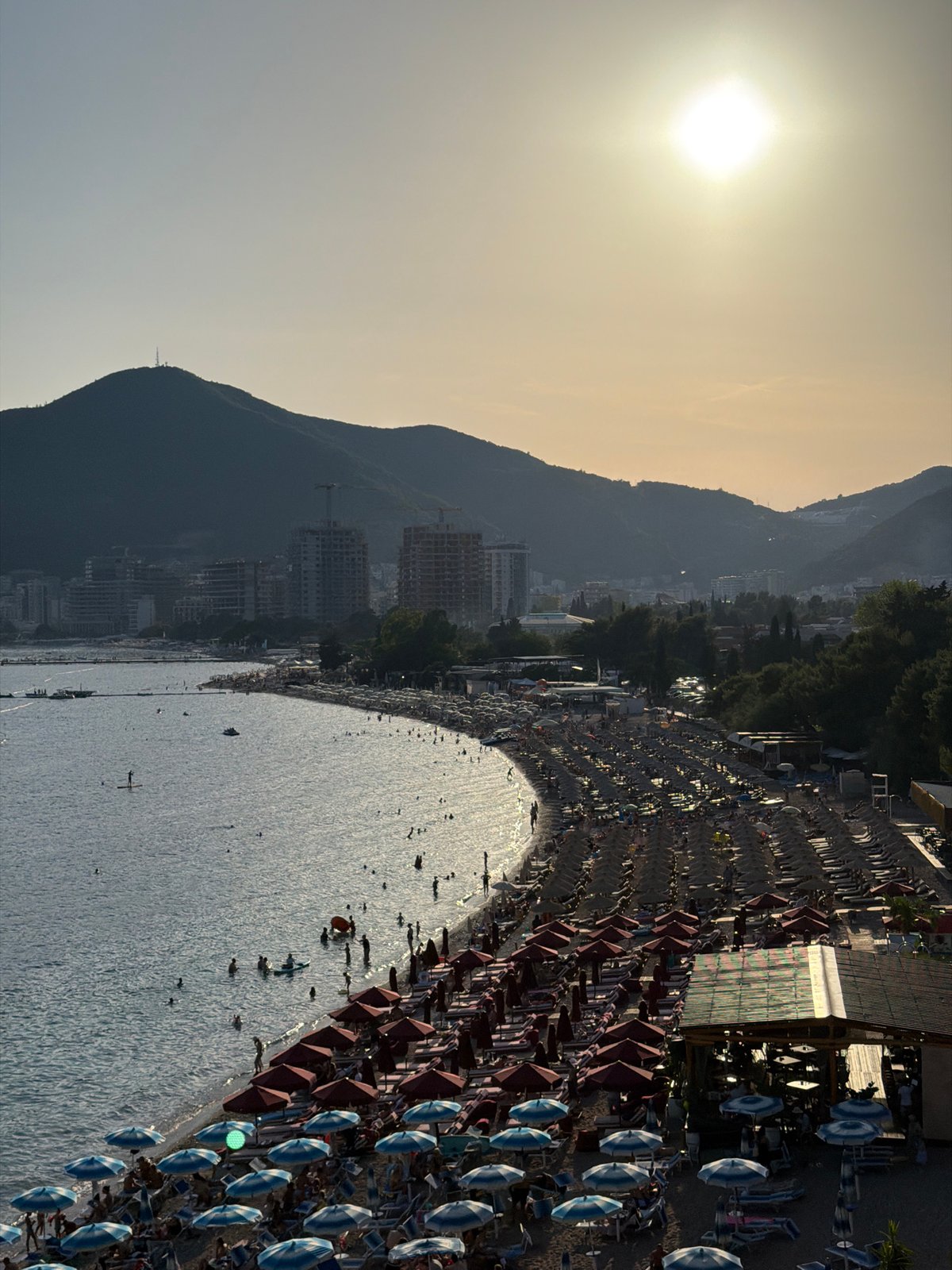 Packed summer beach day on the Adriatic in Boreti, Montenegro