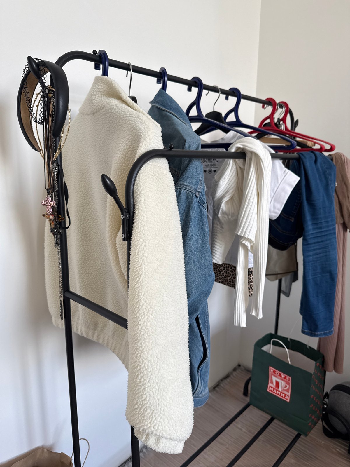 Moscow resident documents clothing rack against wall