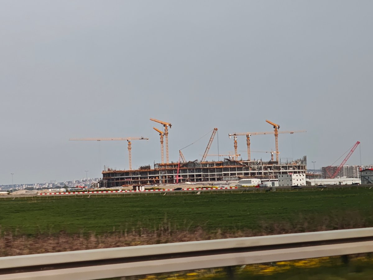 Construction project with yellow cranes documented in Surcin, Serbia