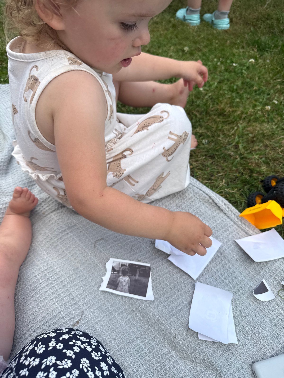 Summer evening in rural Beltershain: cattle, wind turbines, and outdoor gathering