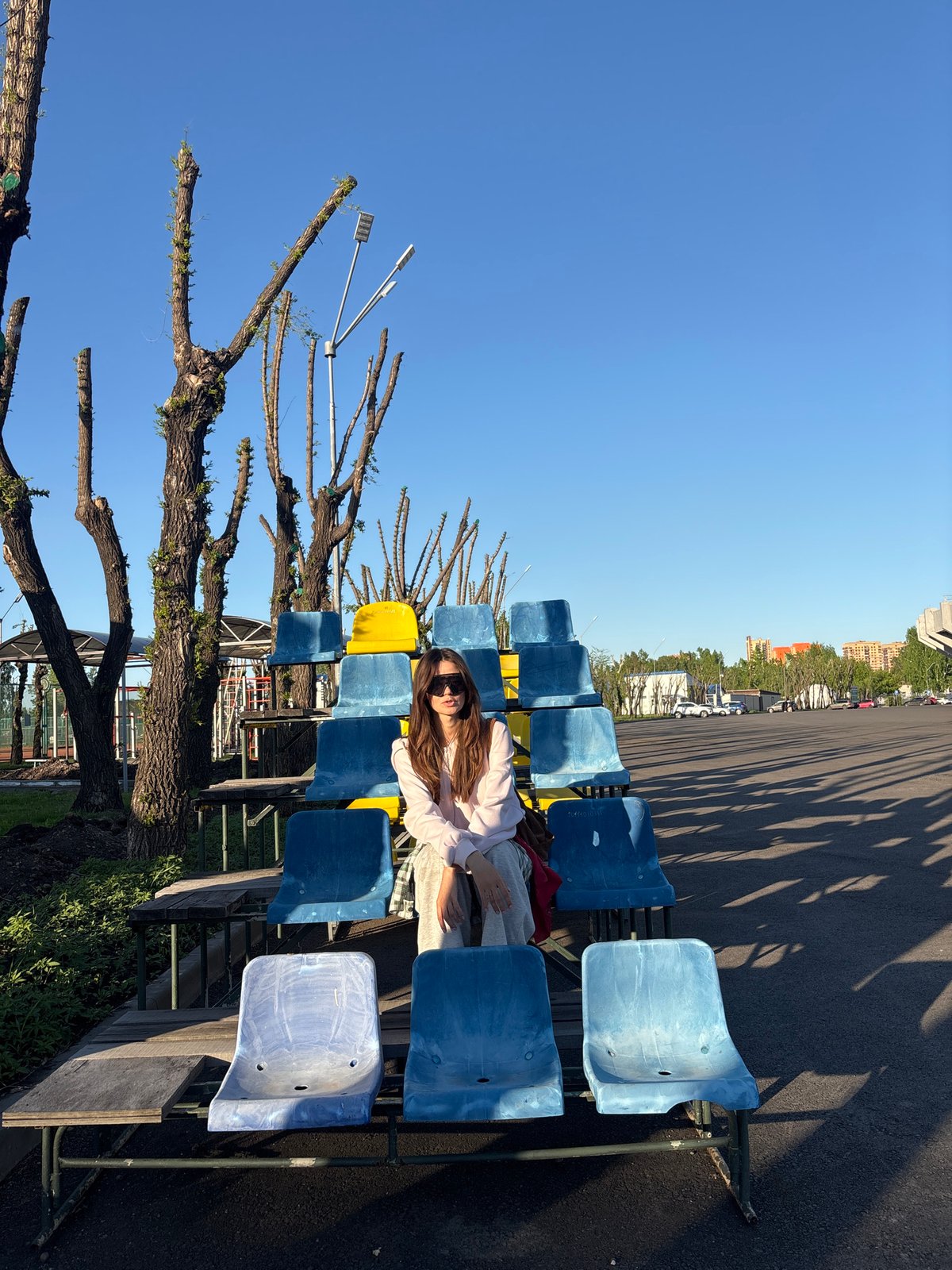 Leisurely afternoon activities documented across Krasnoyarsk stadium and parks