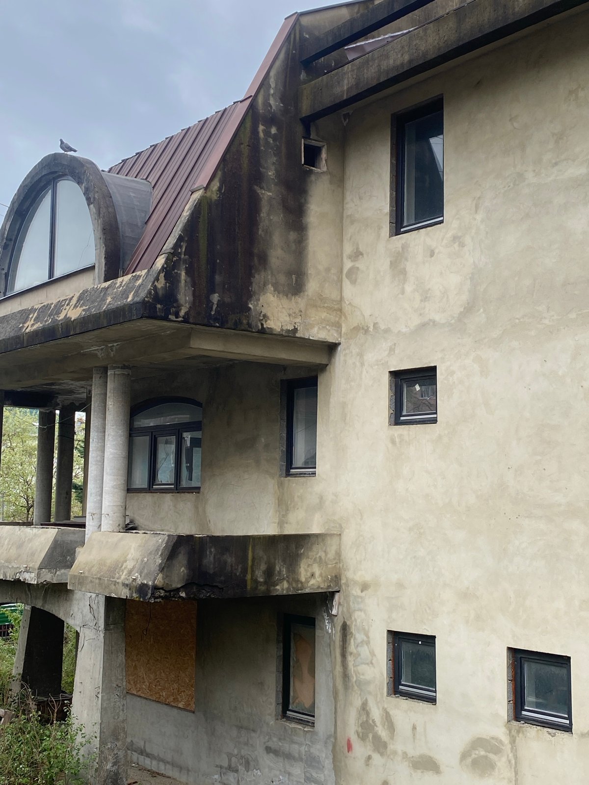 Child photographed at concrete residential buildings in Sochi, Russia