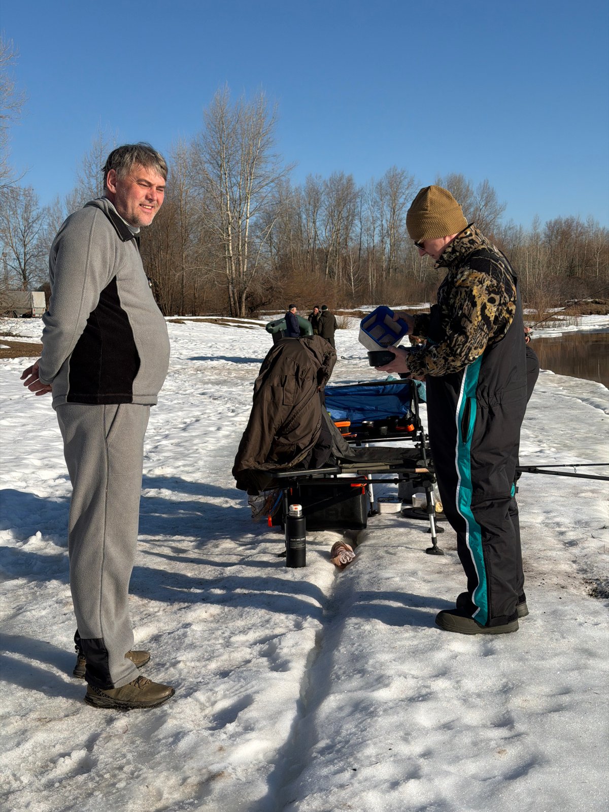 Ice fishing group enjoys sunny winter day in Chaikovsky
