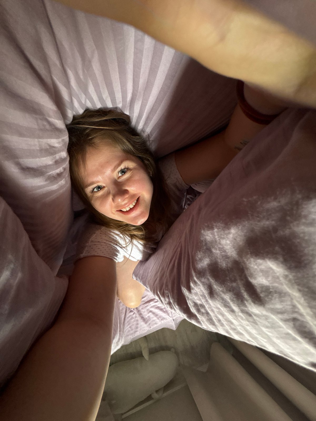 Woman captures morning selfies in bedroom, Gornyi Russia