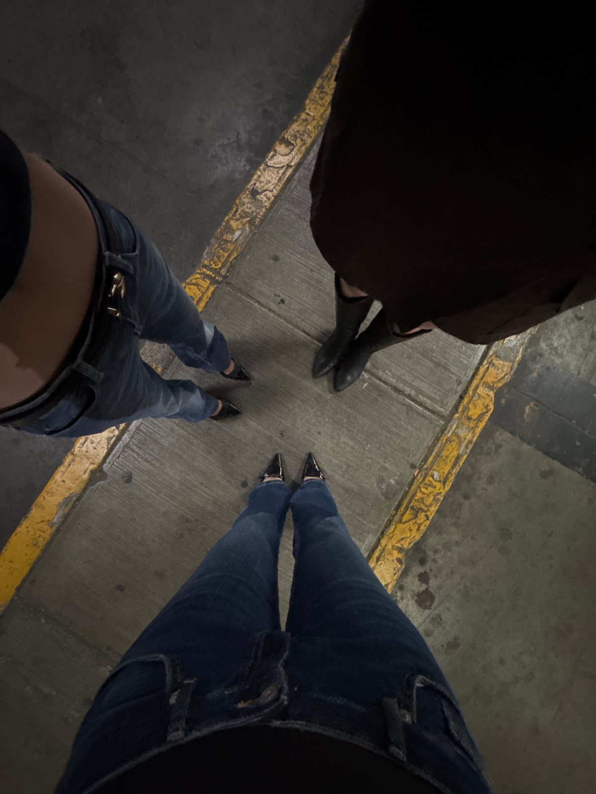 Three people gathered on concrete surface in Mexico City