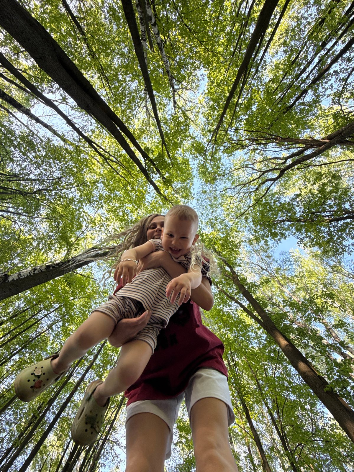 Woman with baby photographed in Russian forest