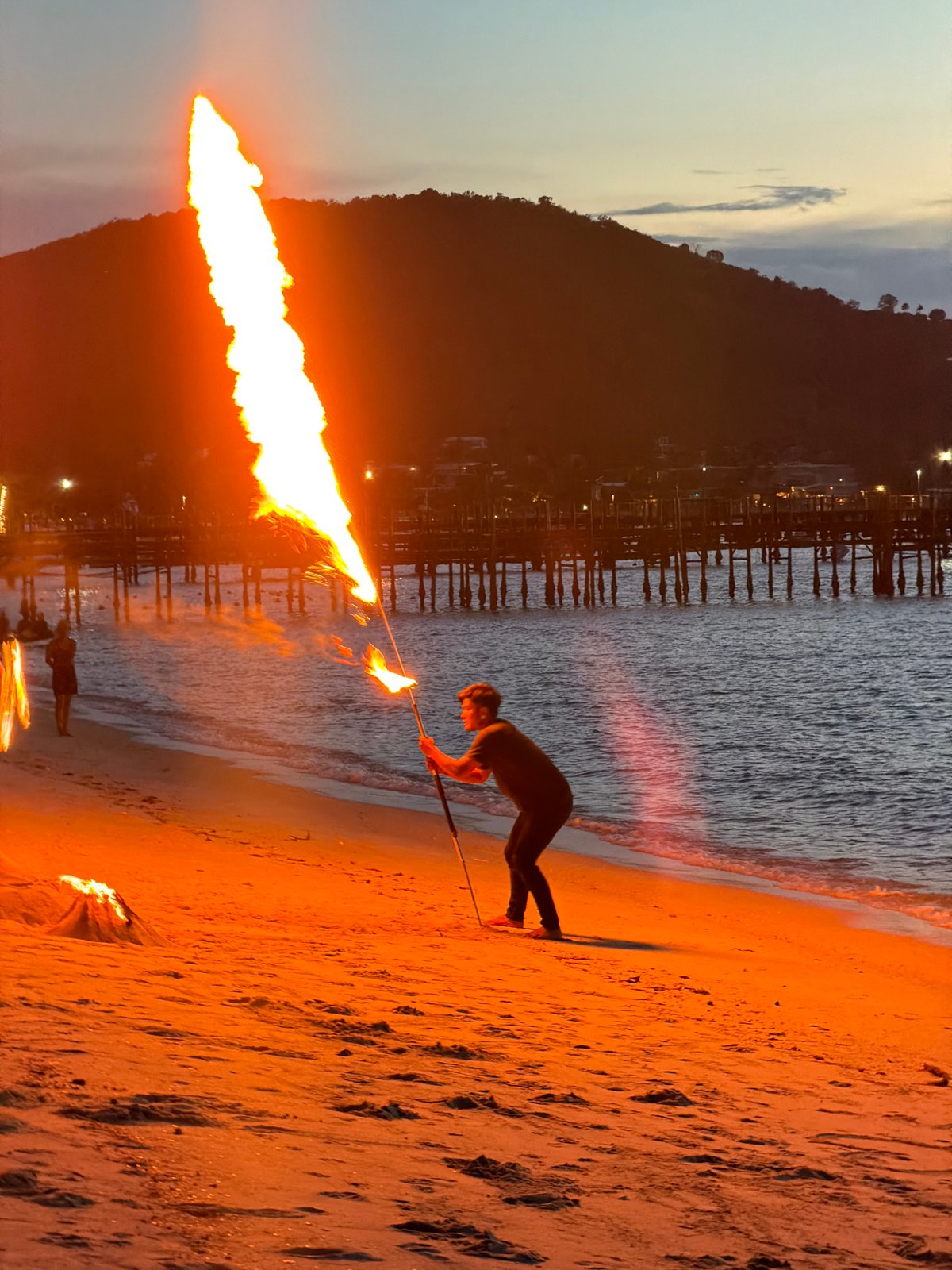 Fire performers and beach scenes at dusk, Ko Samui