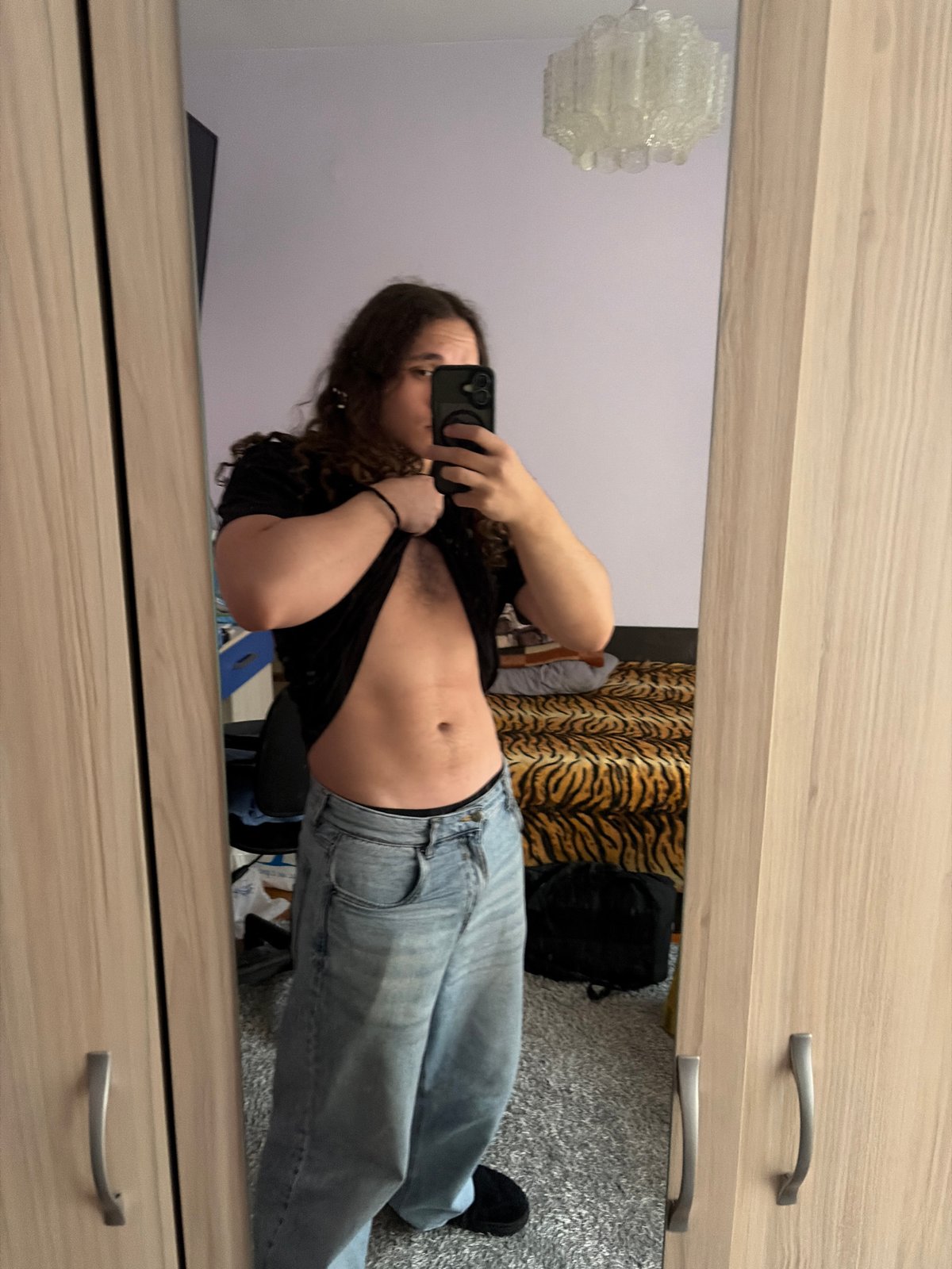 Mirror selfie captured in Asenovgrad indoor setting