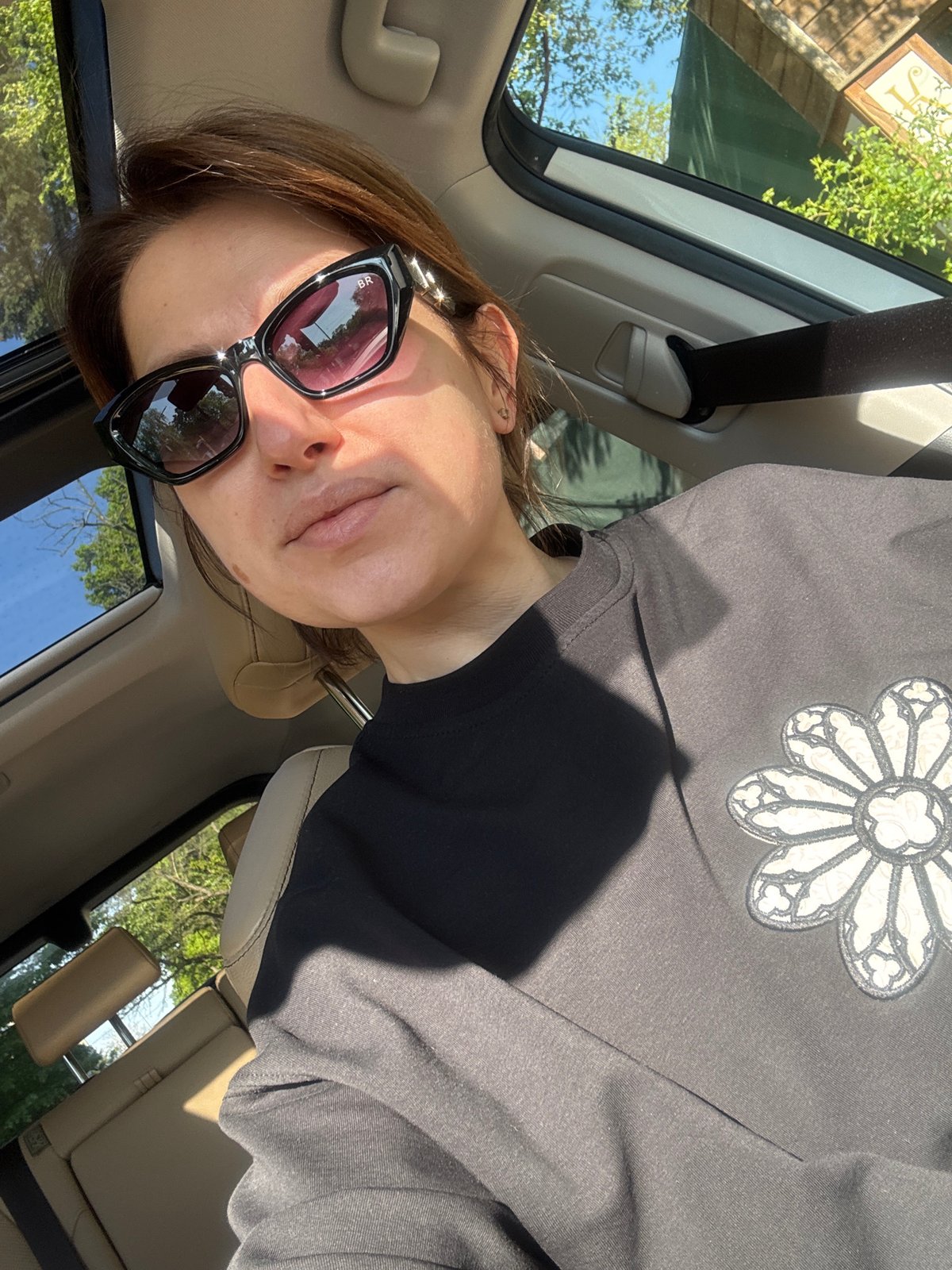 Woman photographed as car passenger on sunny Sofia morning