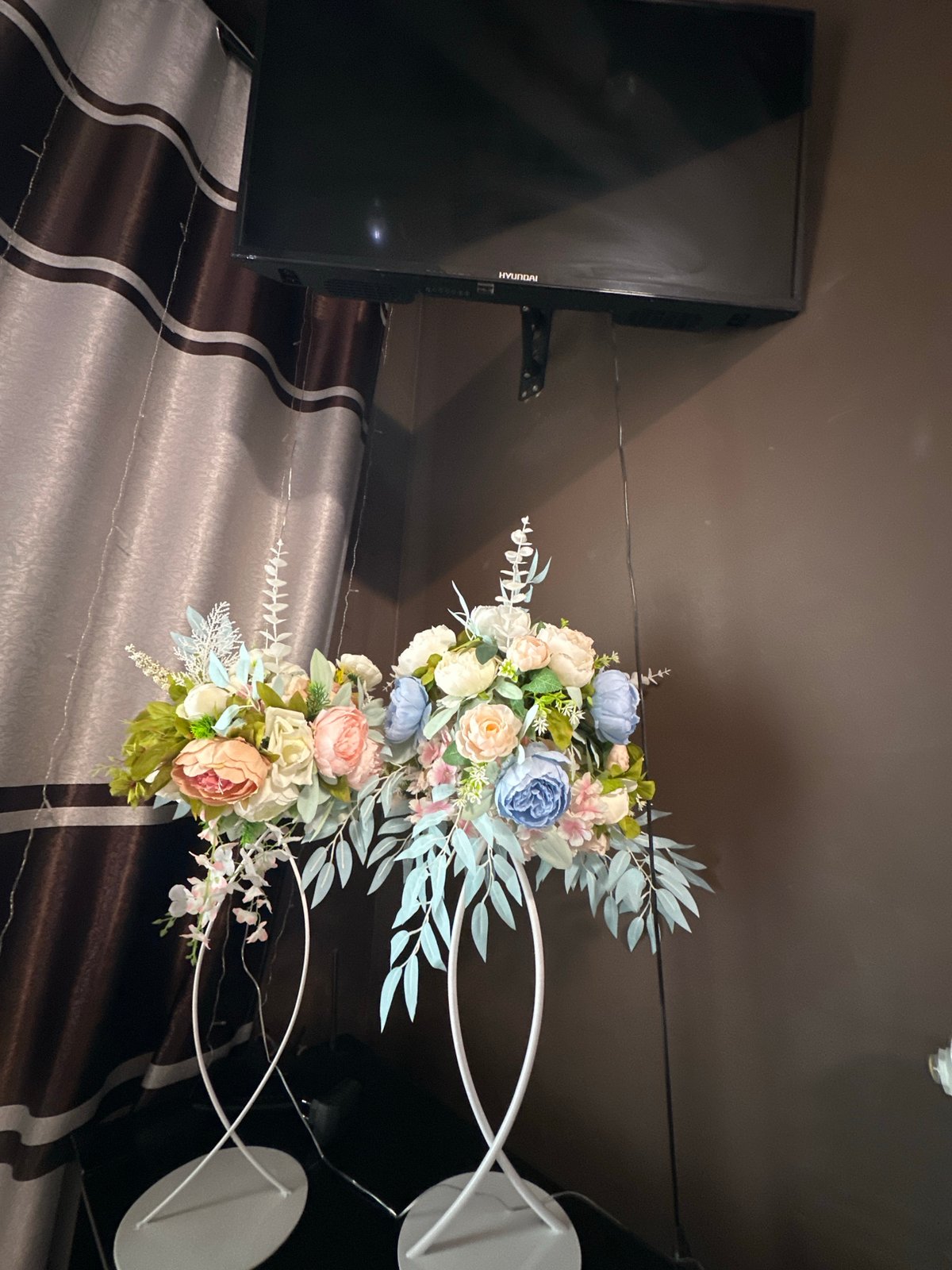 Wedding reception documented with floral arrangements and fairy lights