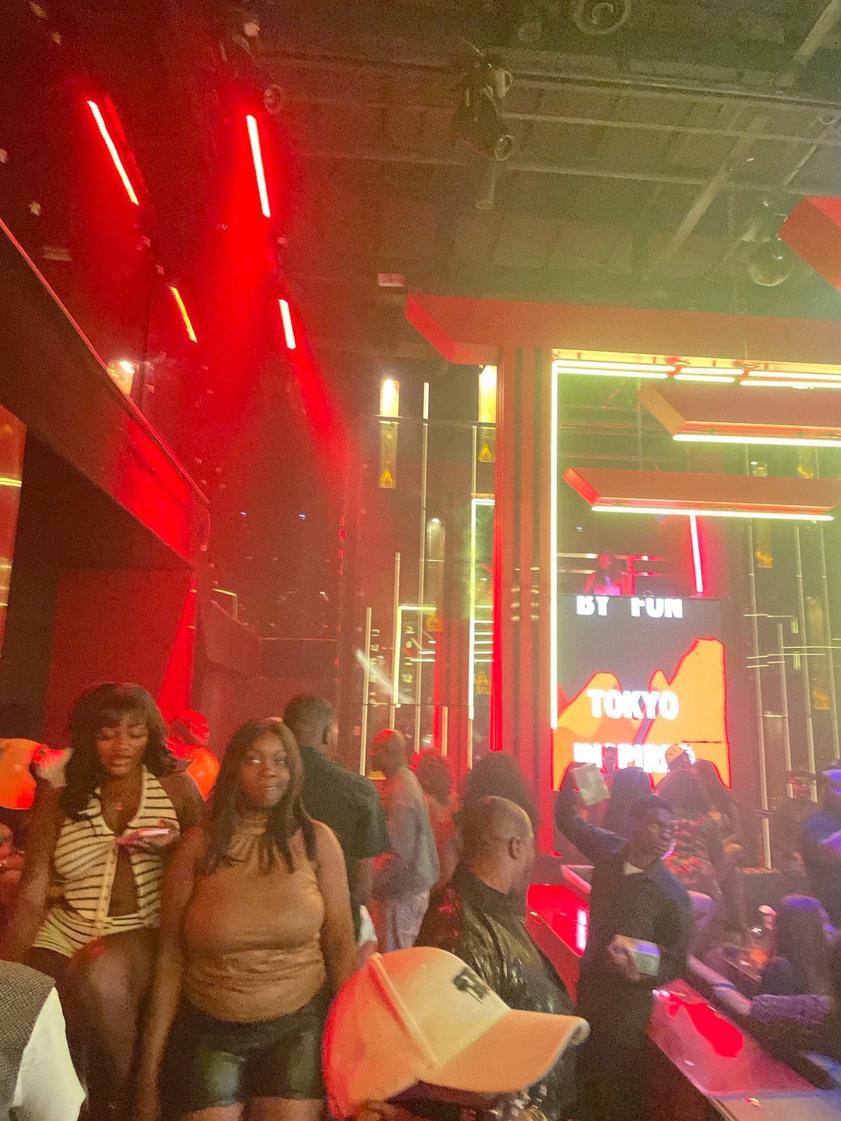 Late-night club scene in Abuja, lights and dancing