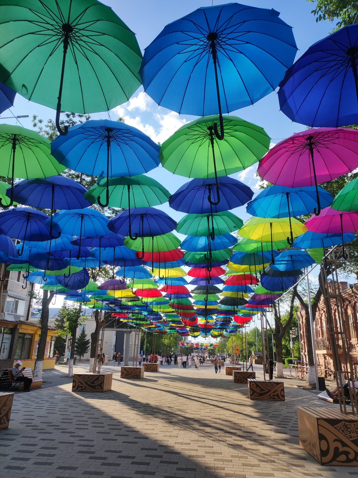 Petropavl pedestrian street lit up with hanging umbrella canopy