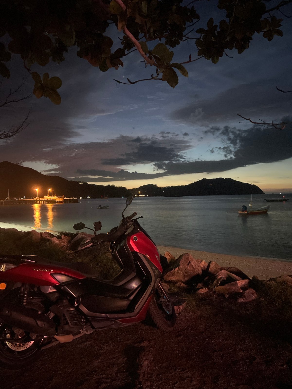Sunset beach evening in Koh Phangan with bars and boats