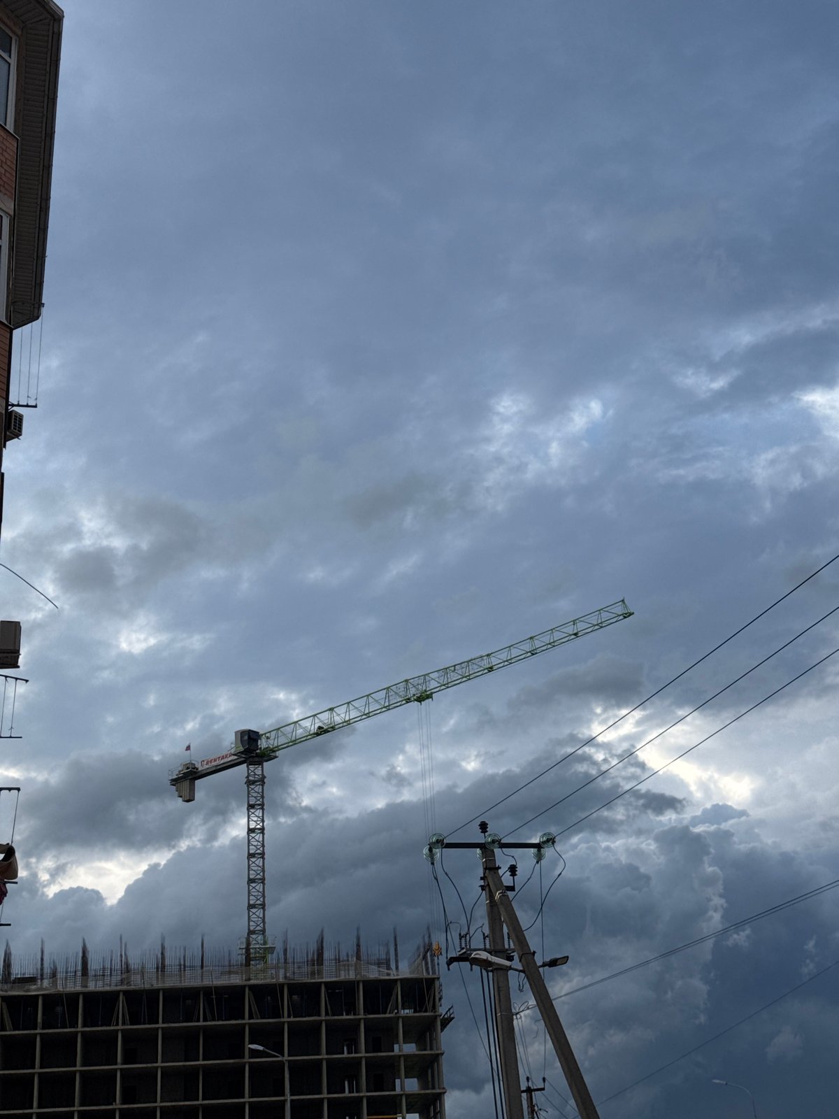 Urban life documented: construction sites, blooming roses, cloudy skies
