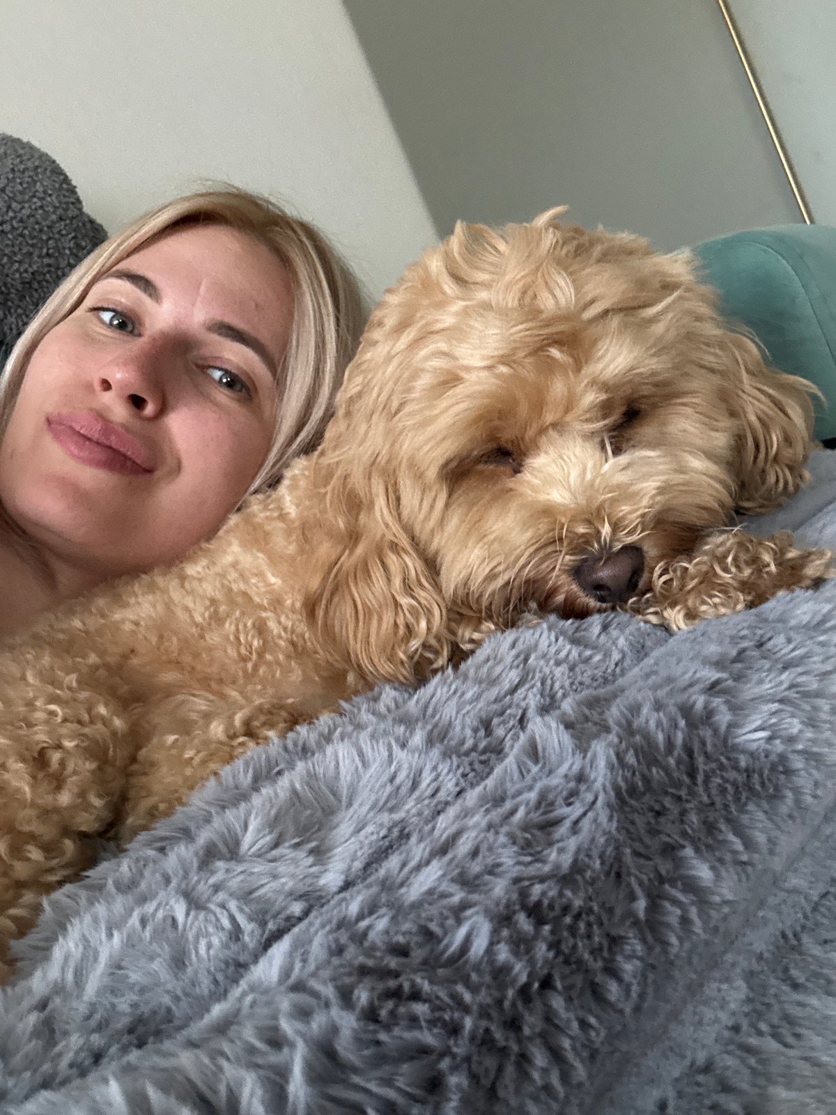 Woman and dog share quiet moment in Saratov home