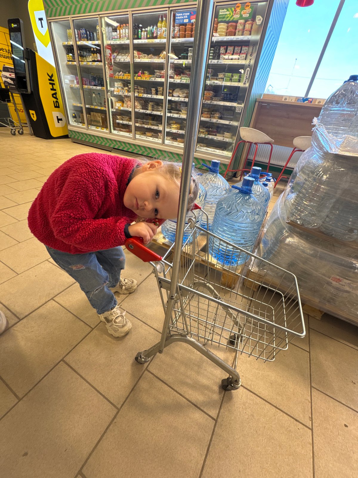 Child sits in water-filled shopping cart in Perm