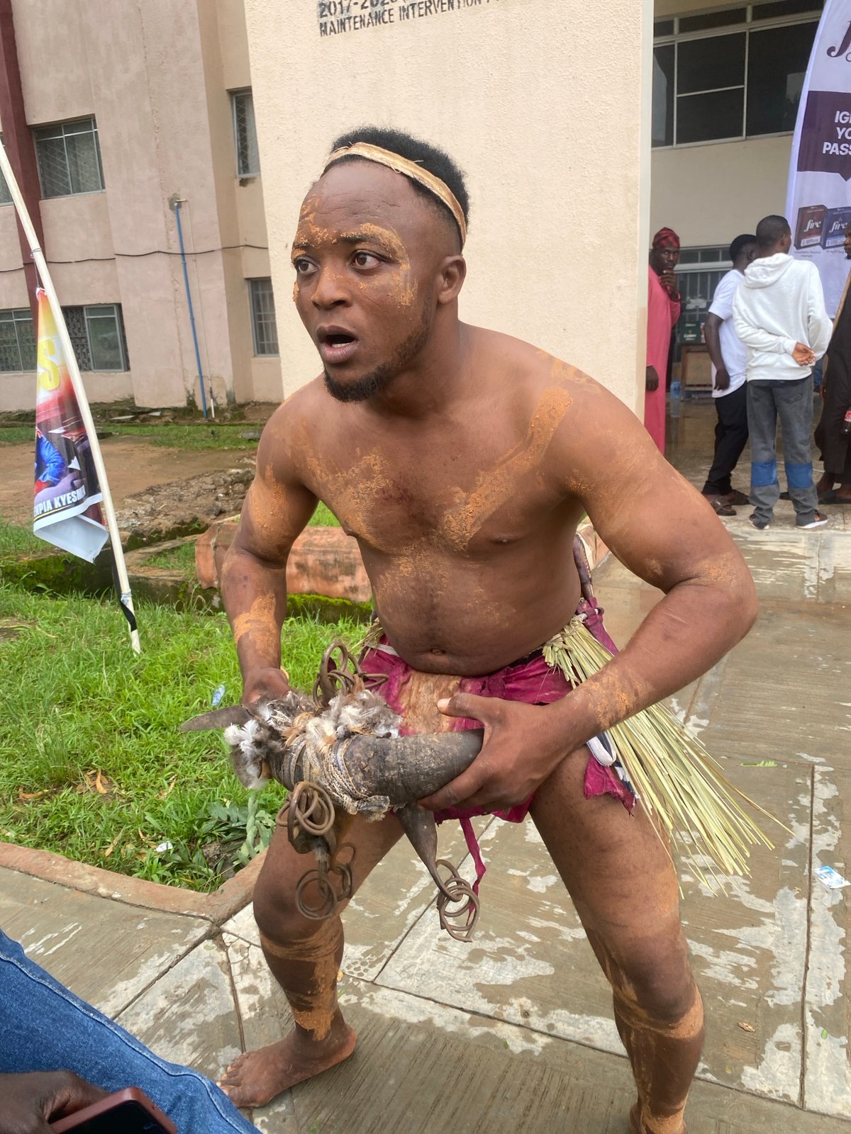 Traditional ceremony with mud-adorned participants in Rafin Par, Nigeria