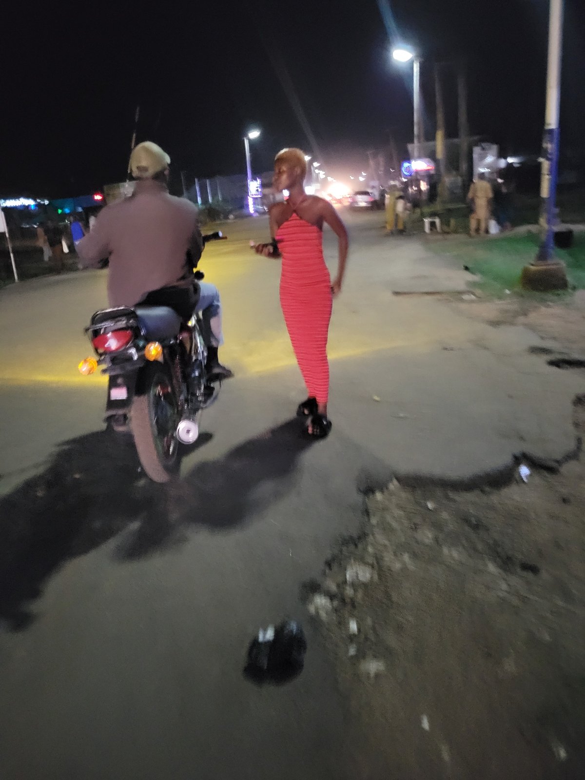 Evening street life documented across unknown urban commercial district