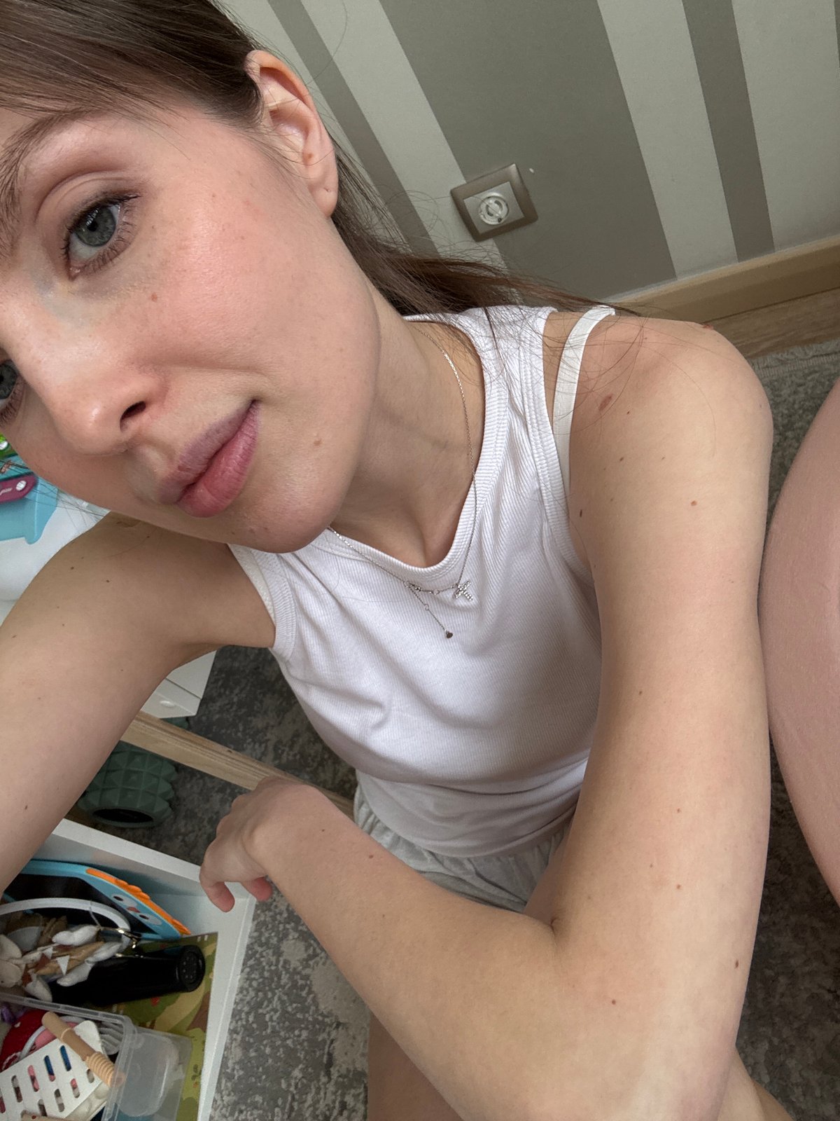 Woman takes tilted selfie indoors in Moscow
