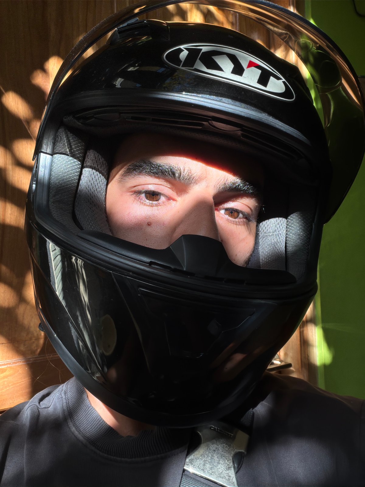 Motorcyclist observed during daytime ride through North Kuta streets