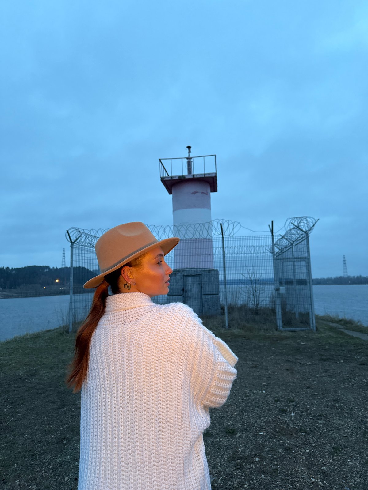 Person spotted by water in Chaikovsky under overcast skies