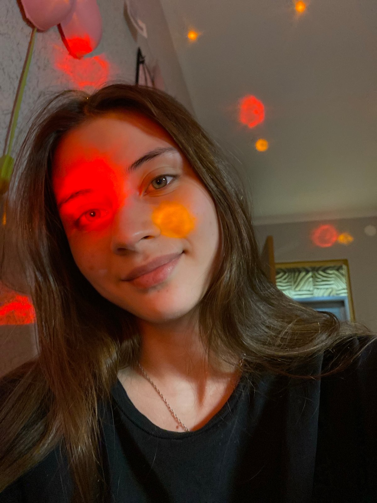 Woman takes colorful disco-lit selfies in Votkinsk apartment