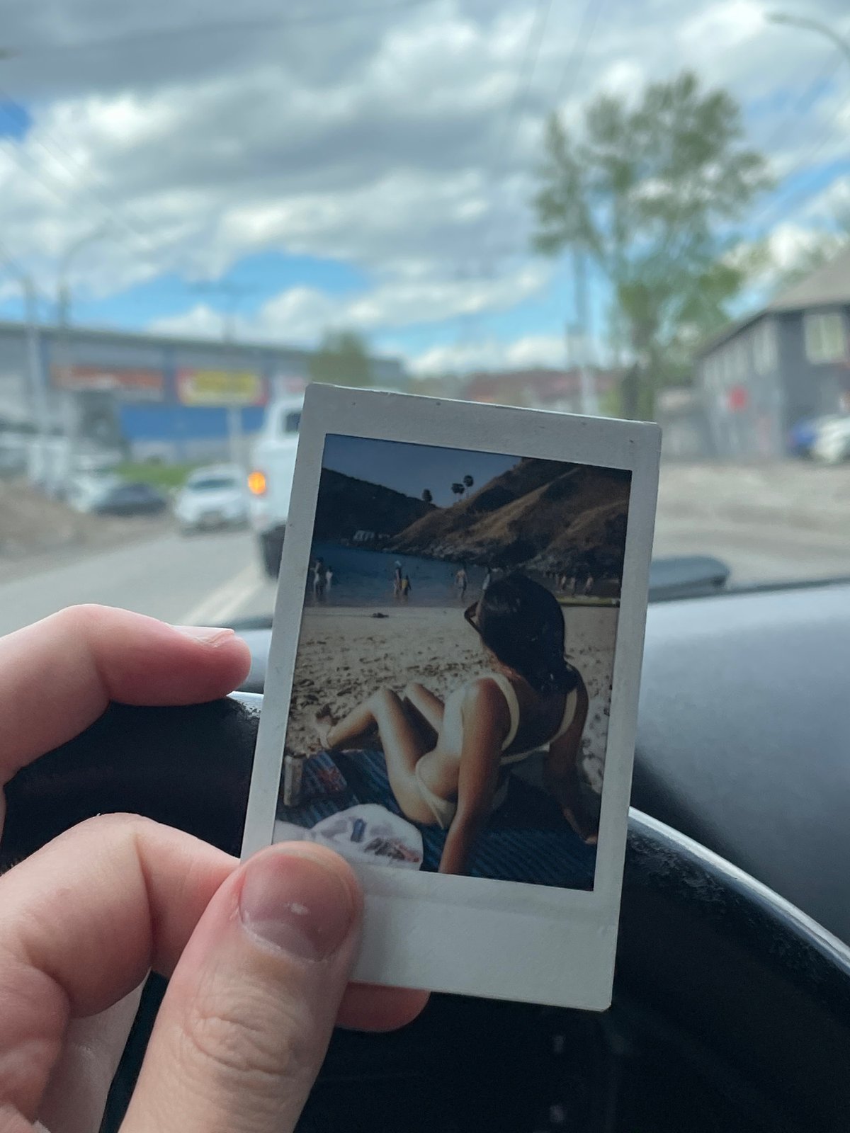 Beach Polaroid held inside car in Krasnoyarsk