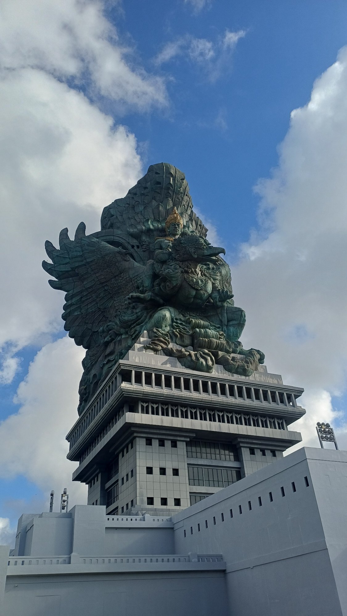 Tourist captures Garuda Wisnu Kencana statue from multiple angles