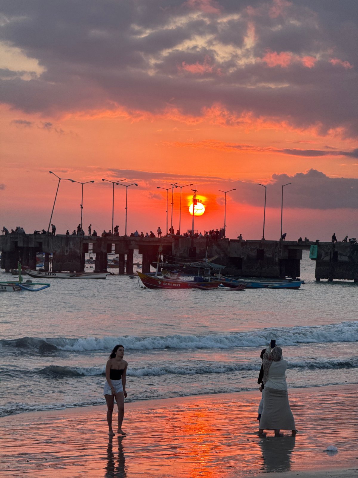 Sunset moments captured by beachgoers in Kuta, Indonesia