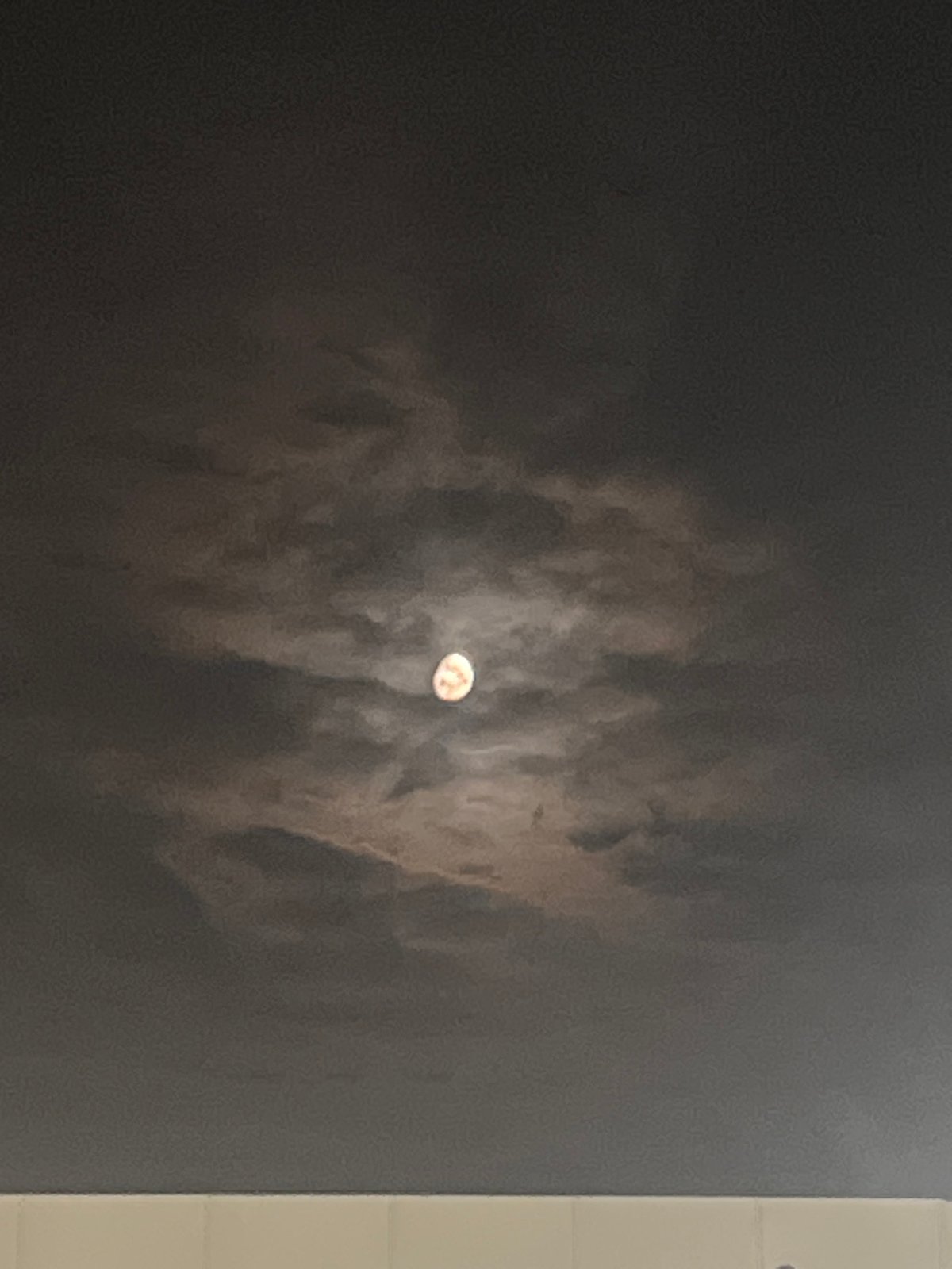 Moon observation captured through clouds in Lupanovo, Russia