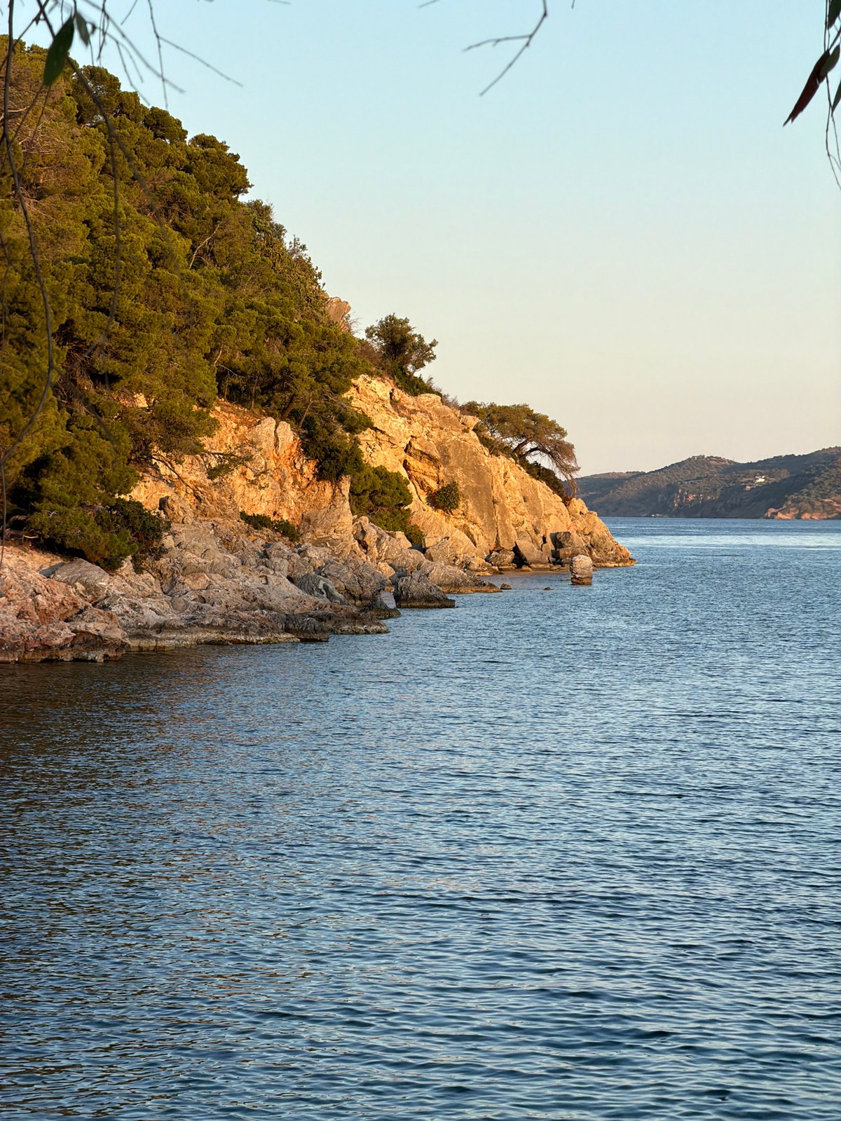 Peaceful coastal scenes documented across Poros, Greece during evening hours