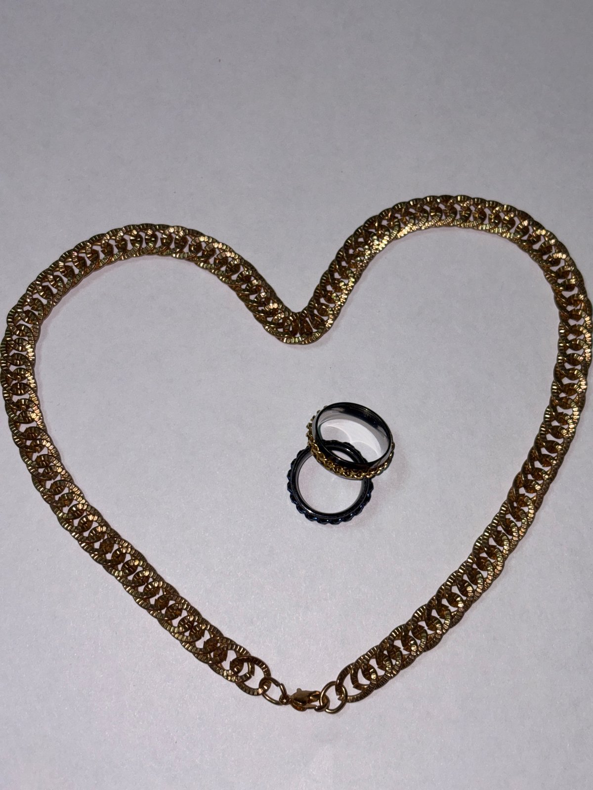 Jewelry collection laid out and styled across everyday surfaces