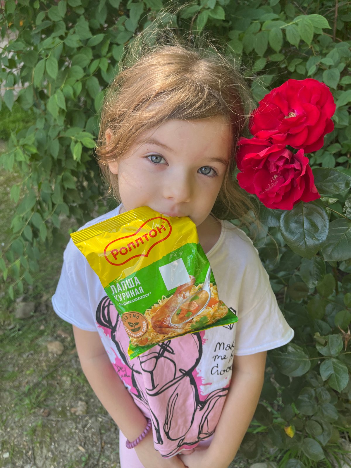 Child enjoys snacks, flowers during morning walk in Sochi