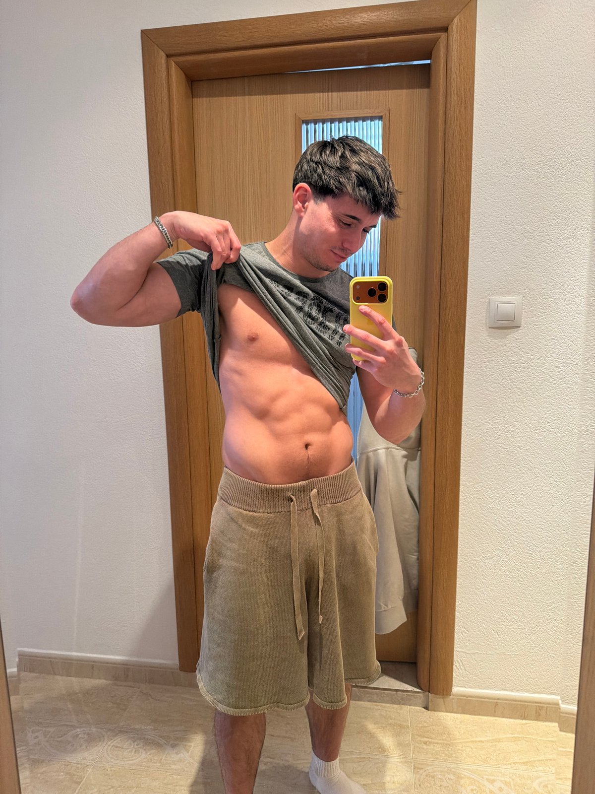 Person takes mirror selfies in Blagoevgrad room