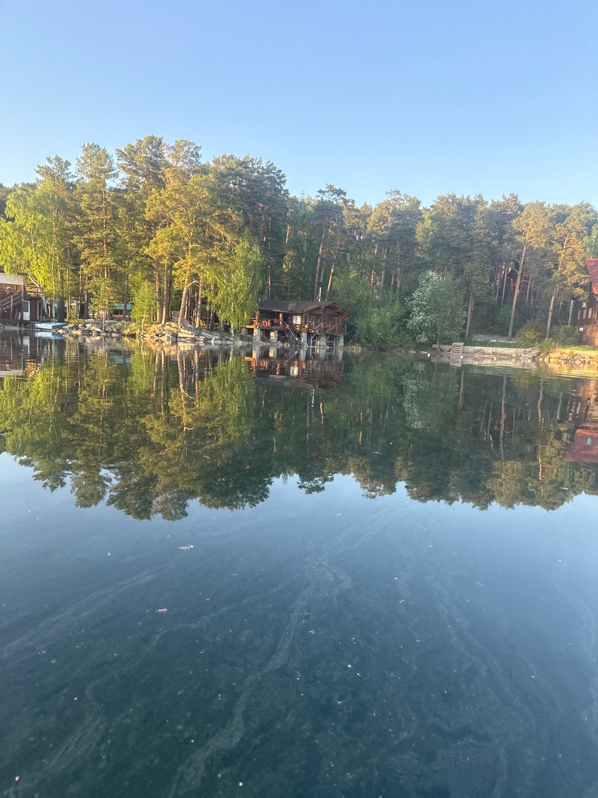 Paddleboard preparation and leisure activities documented at Lake Turgoyak