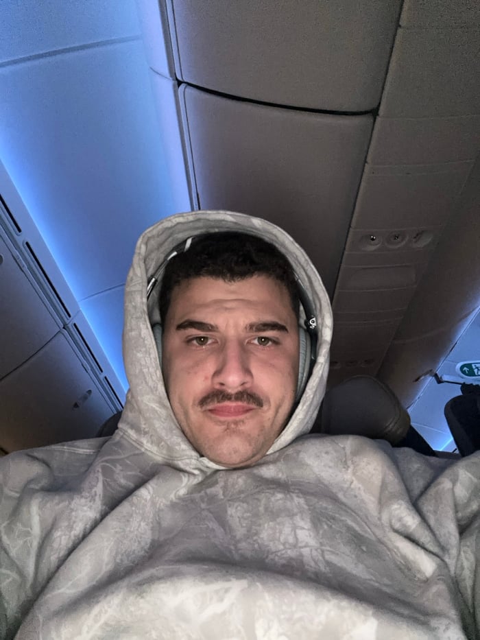 Passenger documents flight journey with selfies and aerial views