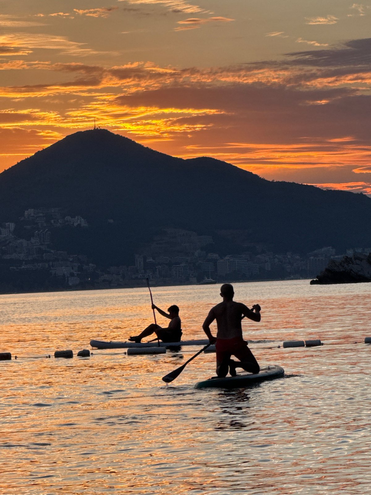 Paddleboarding and swimming at sunset on the Adriatic, Pržno