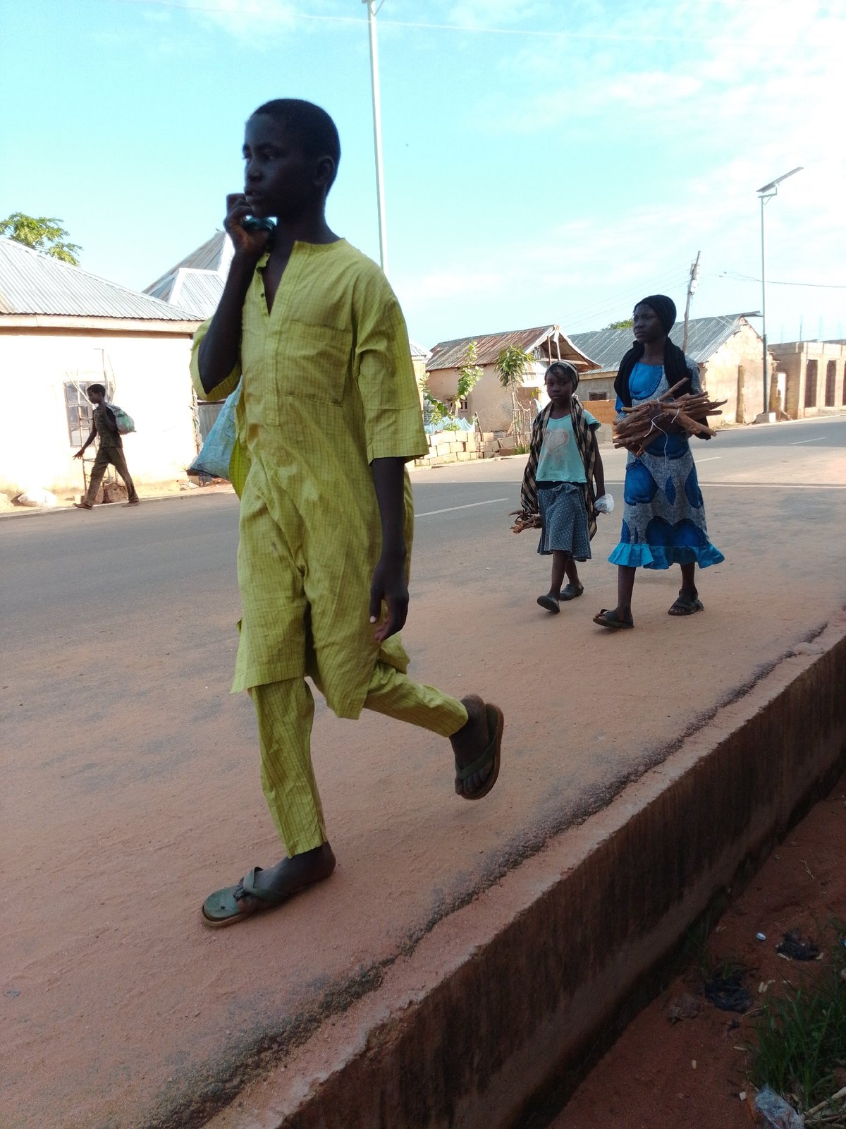 Everyday street life moving through Gombe, Nigeria
