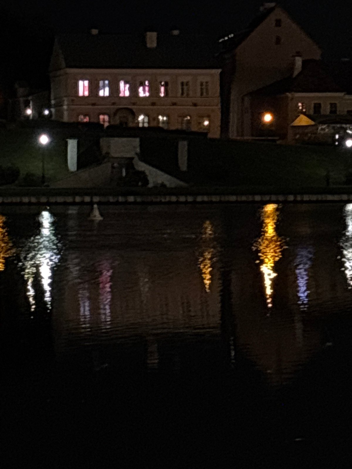 Nighttime photography session captures illuminated Minsk waterfront district