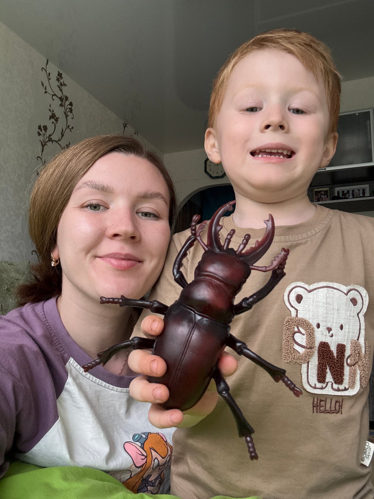 Woman, Boy Share Moment With Beetle Toy in Chaikovsky