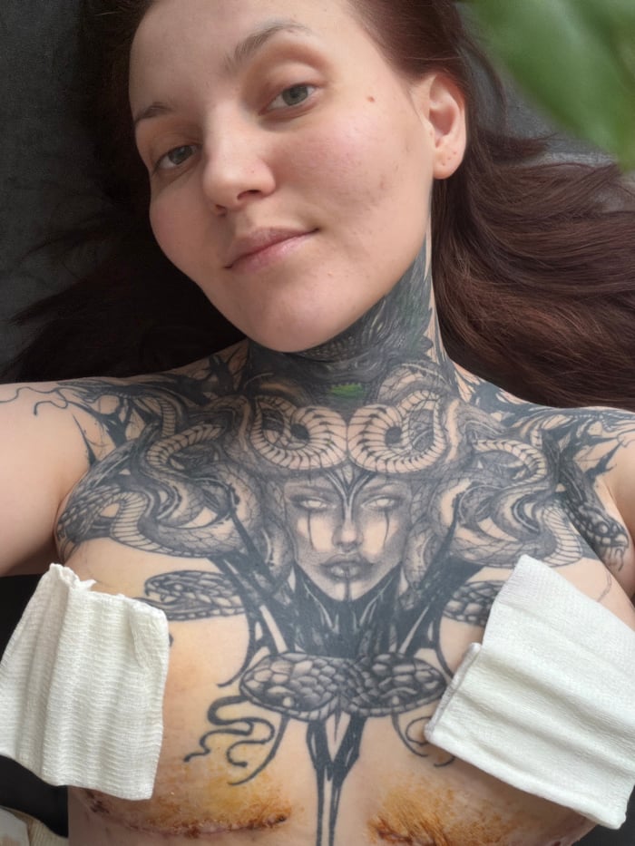 Tattooed woman documented through winter morning in Chaikovsky, Russia