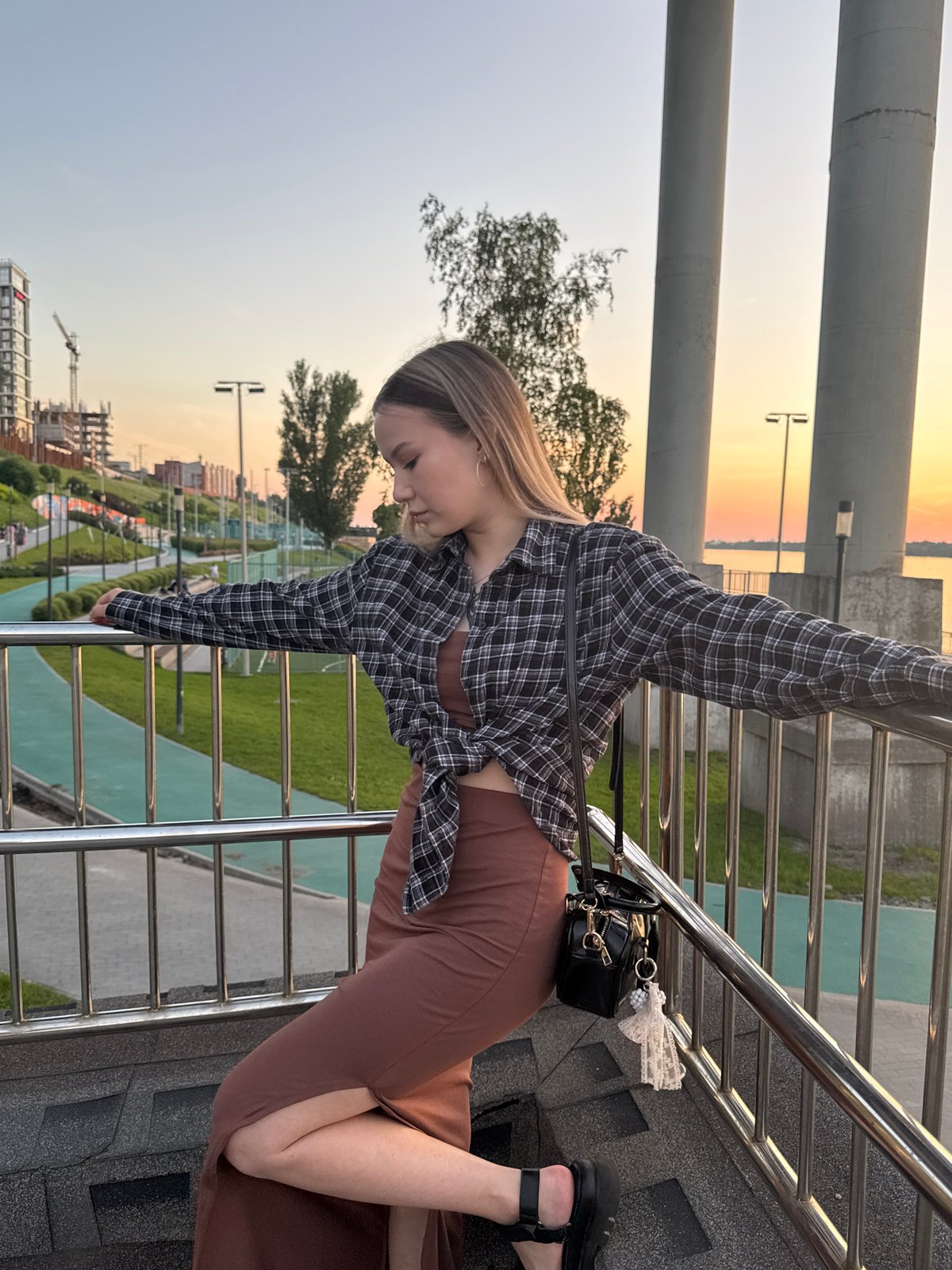 Evening hangout along Perm's Kama River embankment at sunset