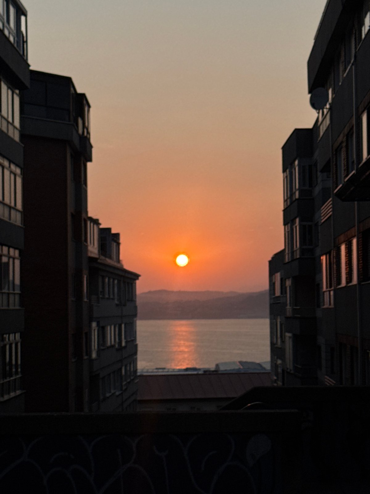 Sunset over Ría de Vigo, plus an elevator selfie