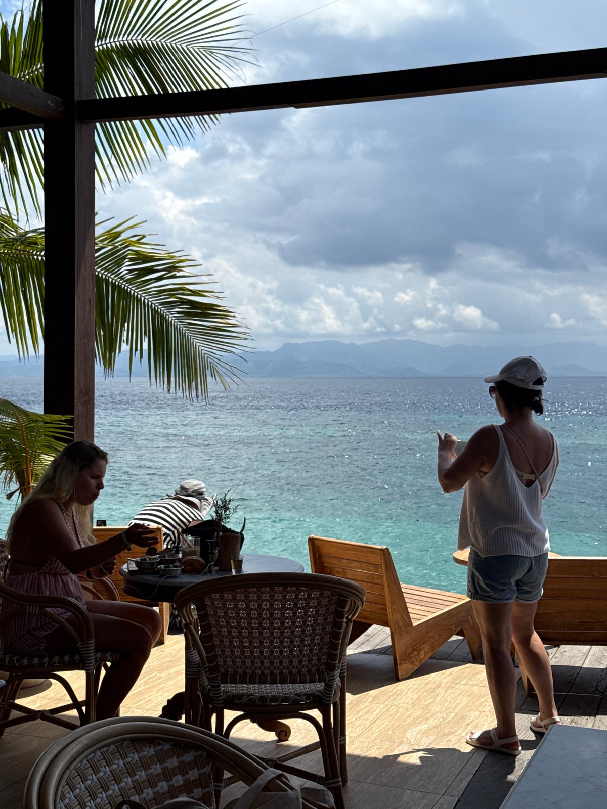 Woman in baseball cap spotted at beachside restaurant in Gianyar