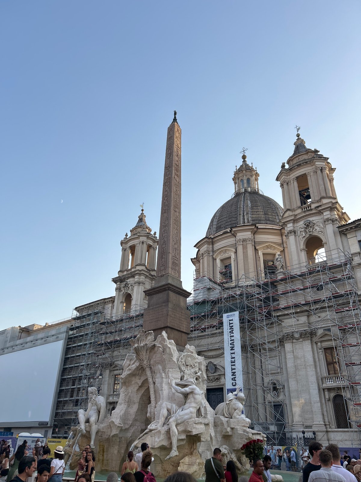 Piazza Navona's iconic fountain and obelisk on a sunny afternoon