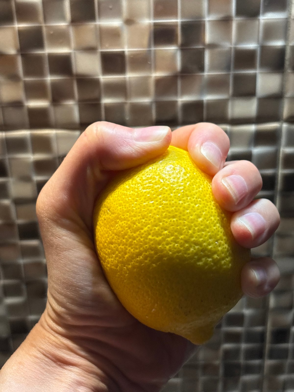 Lemon held up in Bar, Montenegro, tagged #Fruit