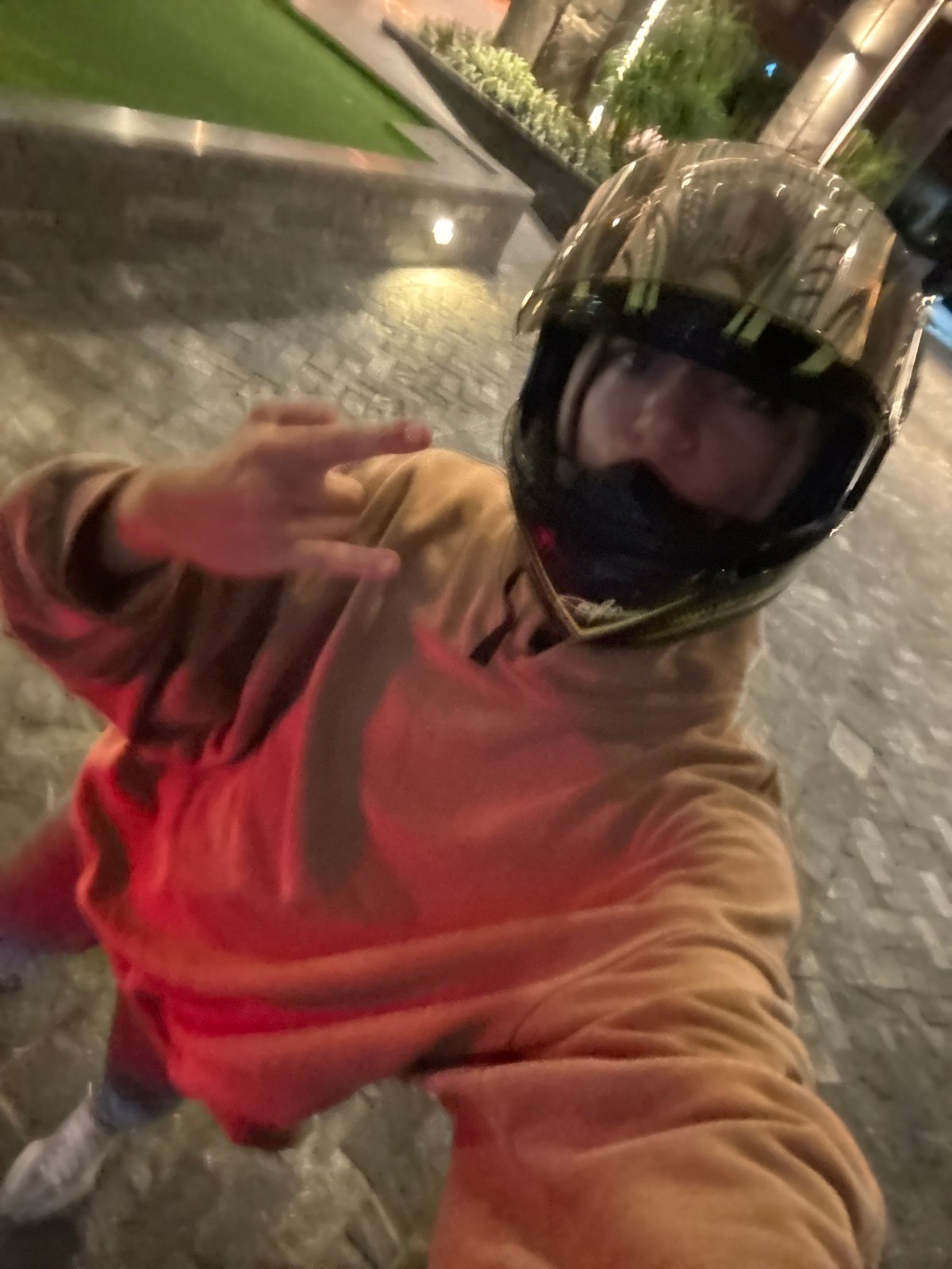 Person poses for photo near hotel entrance in Đà Nẵng