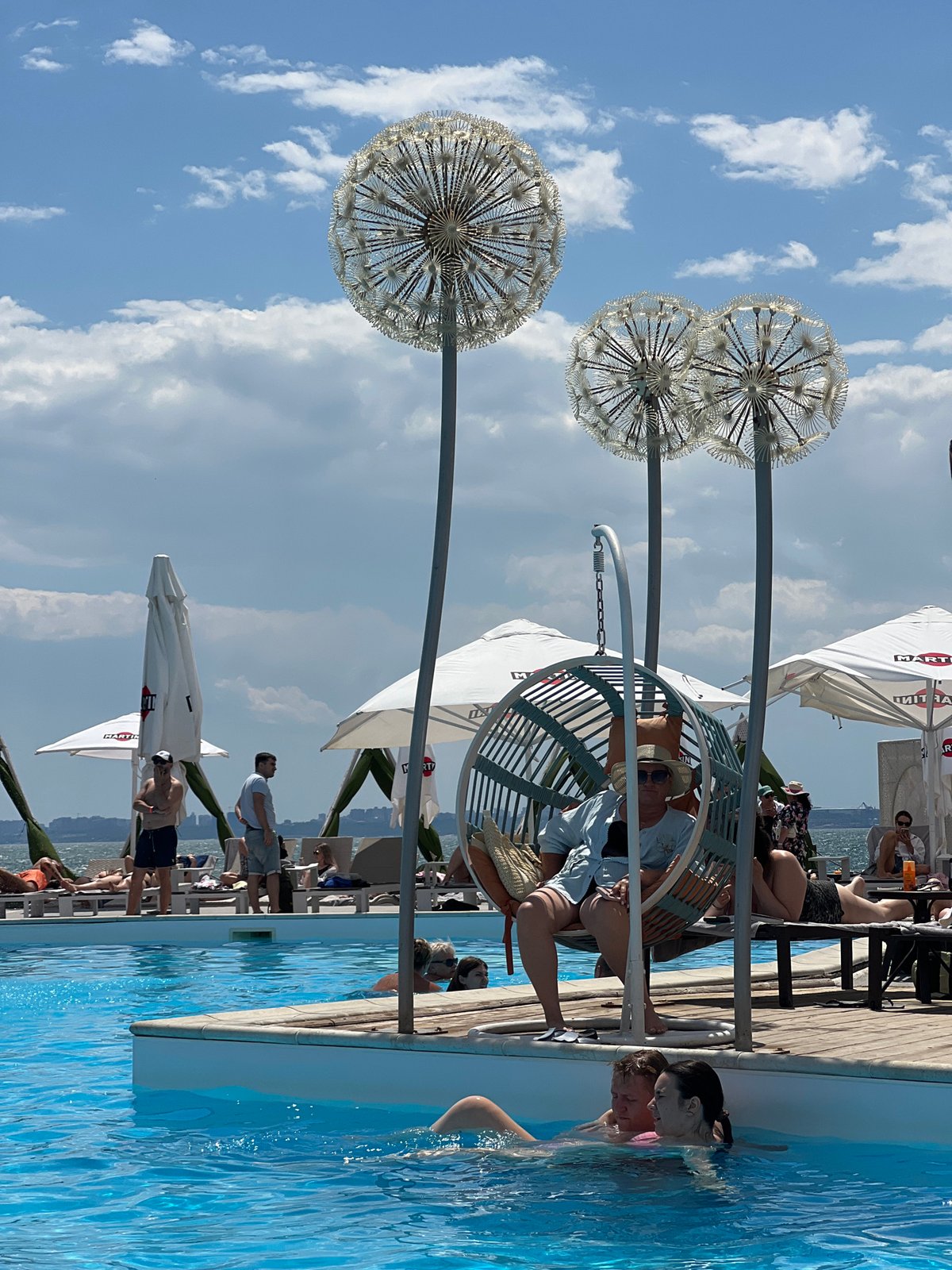 Sunny afternoon at a Fontanka beach club pool